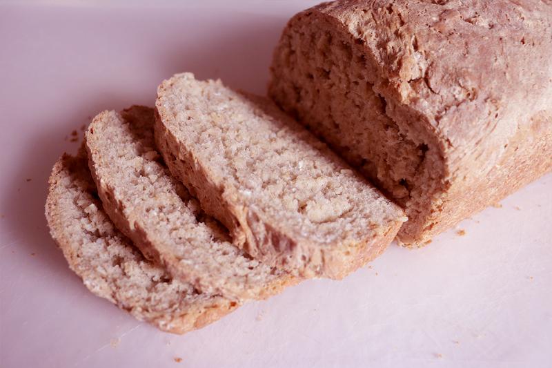 Checking bread doneness with a thermometer