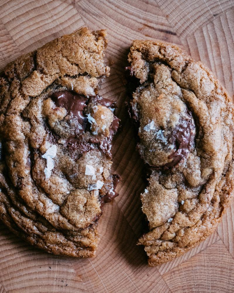 Freshly baked brown butter cookies cooling on a wire rack.