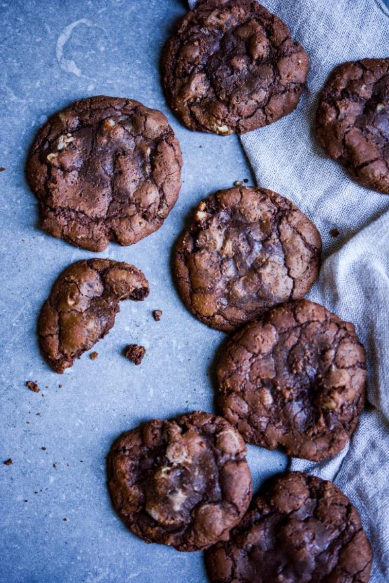 Perfectly baked gluten-free hazelnut cookies on a wire rack.