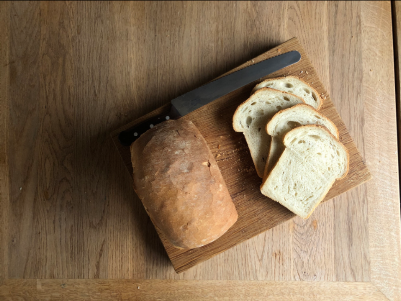 Baked Homemade Bread Loaf Cooling on Rack