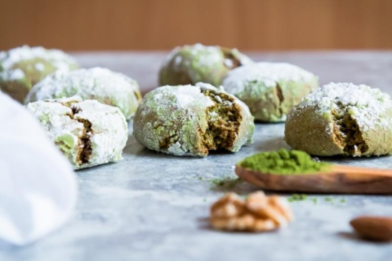 Perfectly baked matcha cookies cooling on a wire rack.