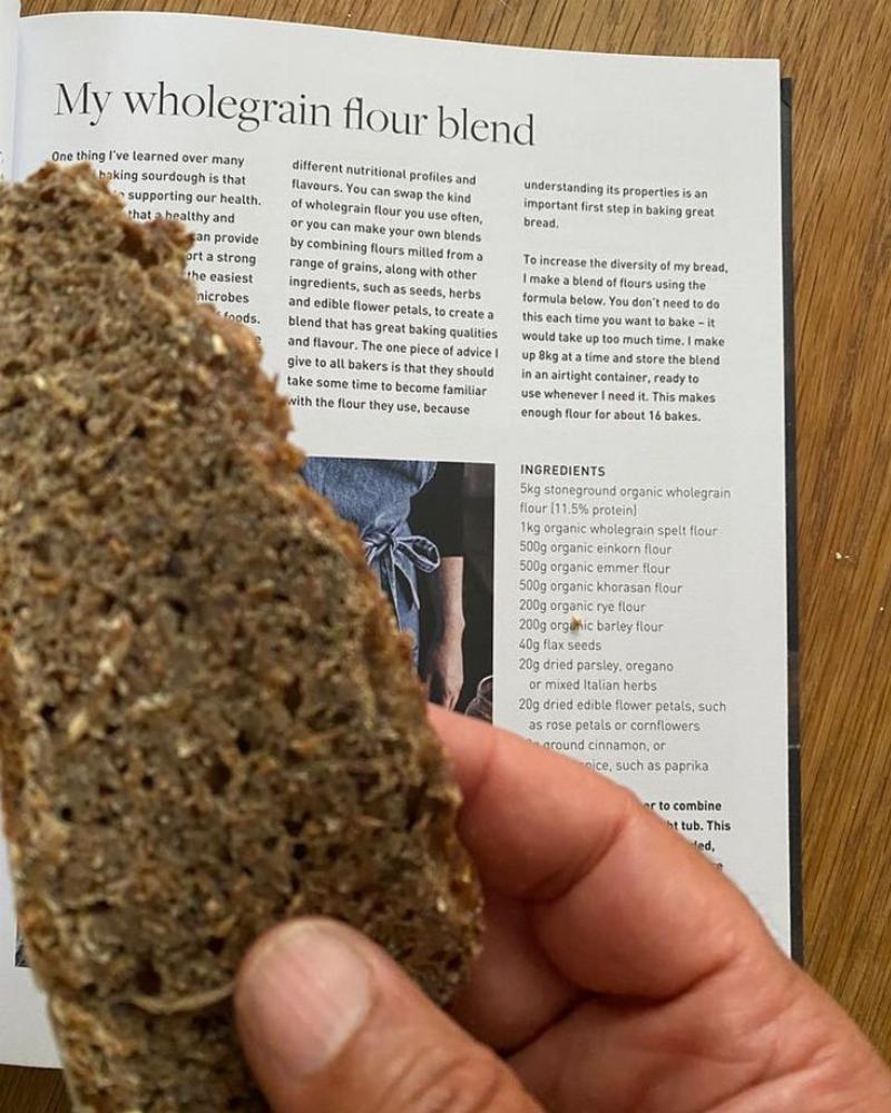 Baked multigrain bread loaf on a cutting board