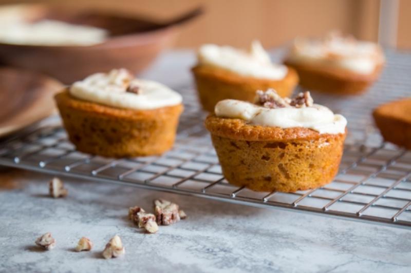 Freshly Baked Peach Cupcakes Cooling on Wire Rack