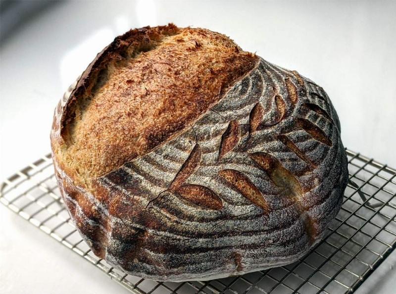 Baked Sourdough Bread Cooling on Rack