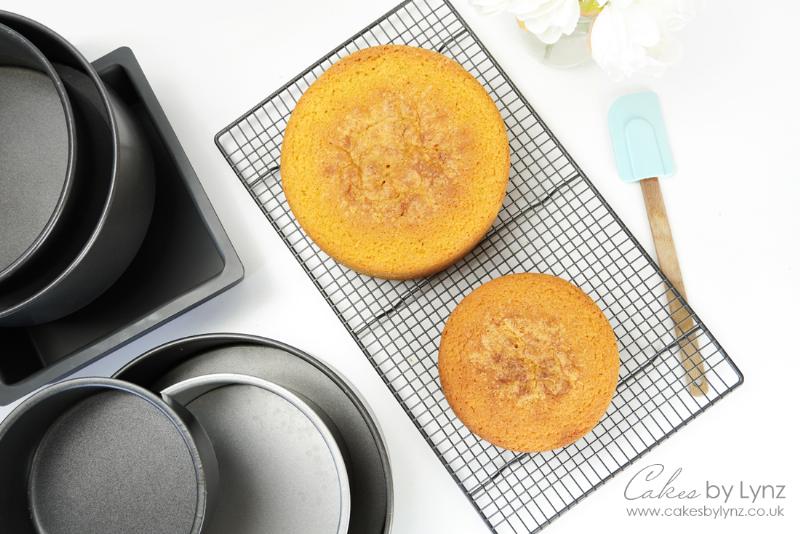 Baking vanilla cake layers in two 9-inch round cake pans.