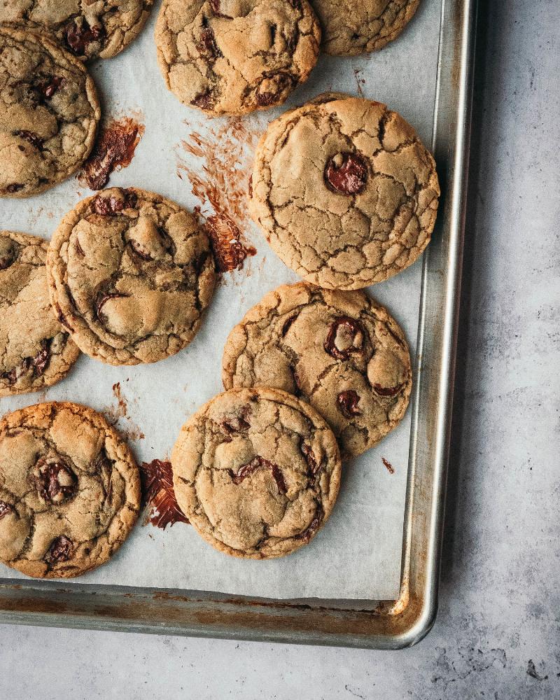 Chocolate chip cookies baking in the oven at 350°F.