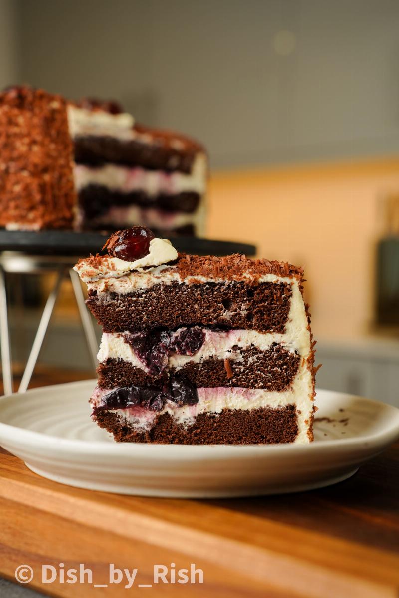 Assembling Black Forest Cake with Whipped Cream and Cherries