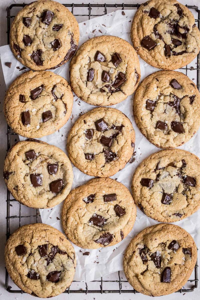 Close-up of a golden brown butter cookie, showcasing its crisp edges and nutty aroma.