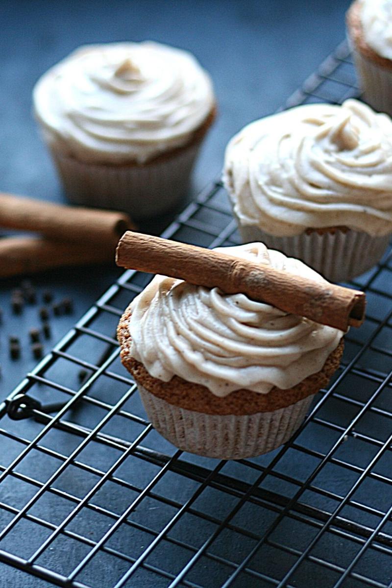 Piping Chai Cream Cheese Frosting onto Cupcakes