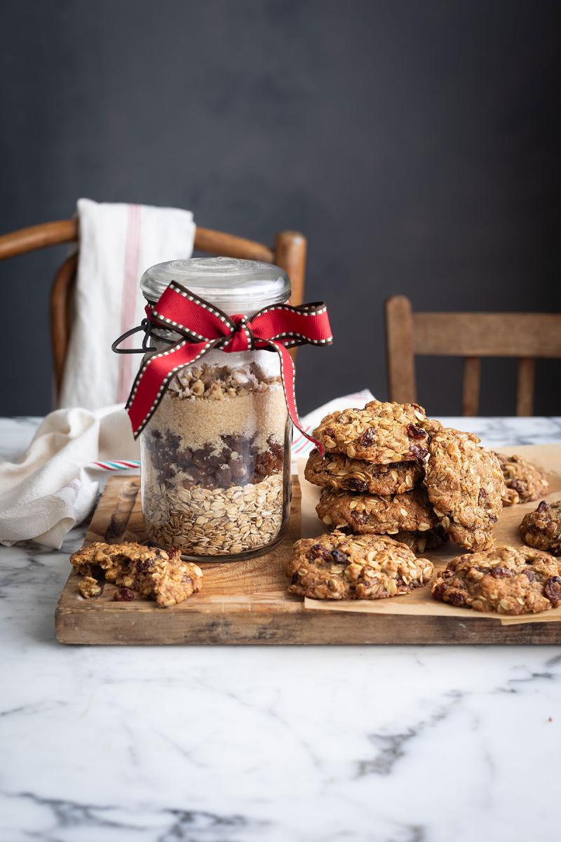 Freshly baked chewy cookies stored in a jar