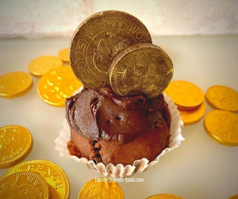 Chocolate Cupcakes Being Frosted and Decorated