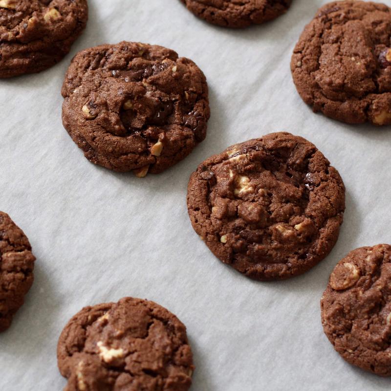 Scoops of Chocolate Hazelnut Cookie Dough on Baking Sheet