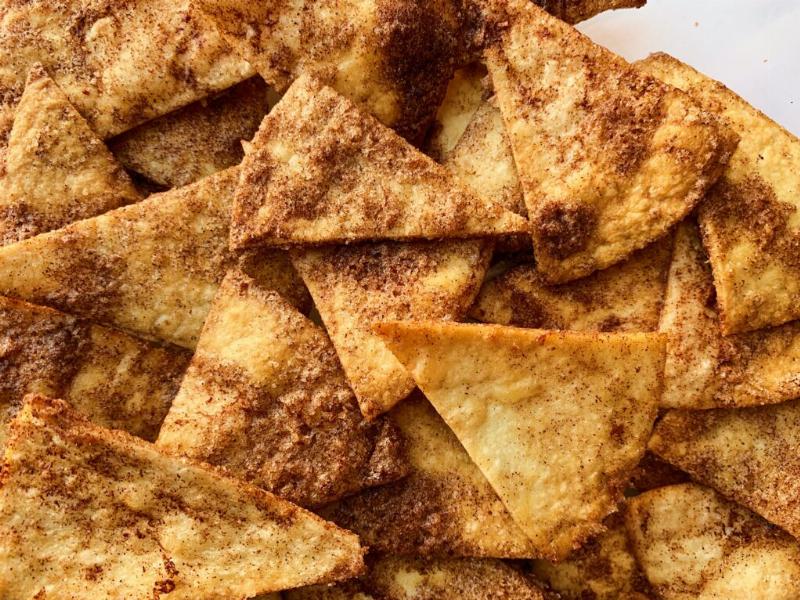 Cinnamon cookies arranged on a baking sheet, ready for the oven.