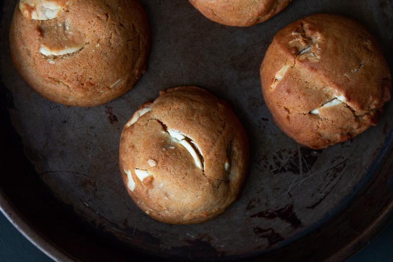 Freshly baked cinnamon cookies cooling on a wire rack.