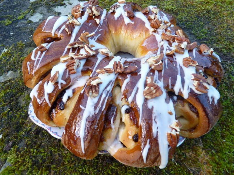 Spreading cinnamon filling on rolled-out dough