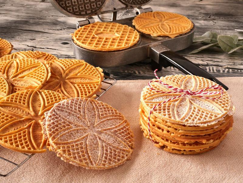 Pizzelle Ingredients and Equipment: Flour, sugar, eggs, butter, baking powder, anise extract, and a pizzelle iron.