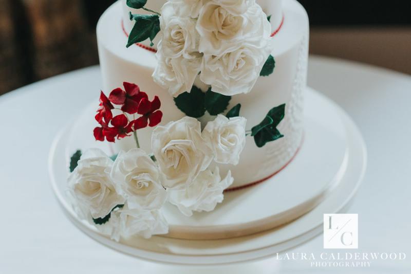 Classic Vanilla Wedding Cake with cascading sugar flowers