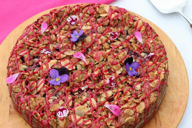 Steps involved in baking a coffee cake, from mixing ingredients to adding streusel.