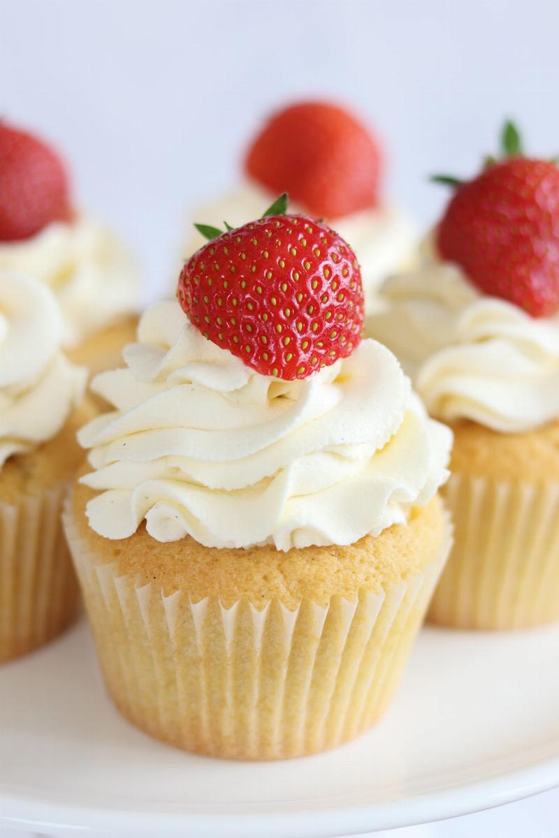 Decorated cupcakes with whipped cream frosting