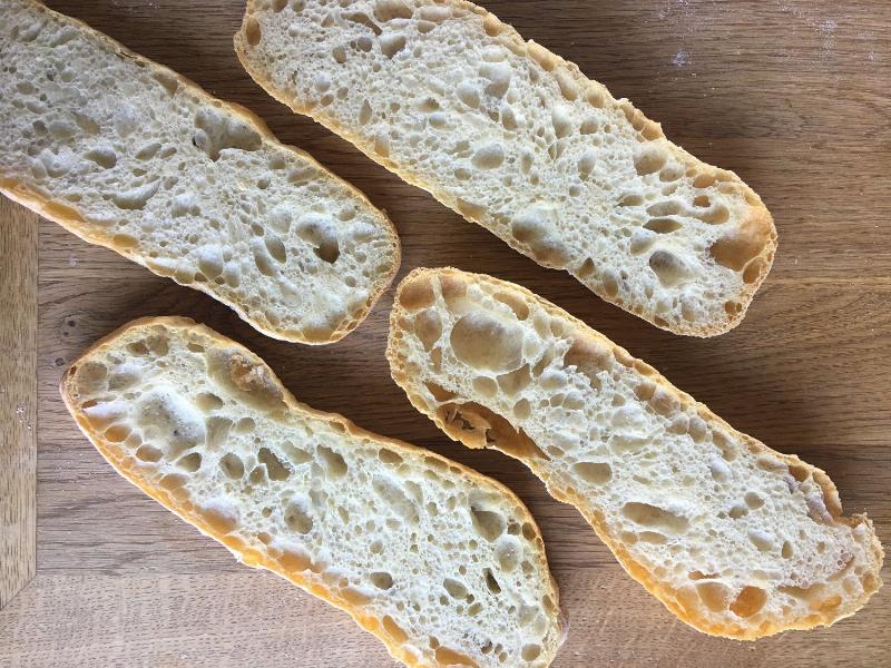 Mixing ciabatta dough in a large bowl