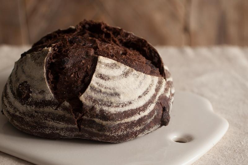 Evenly baked sourdough bread on a baking stone