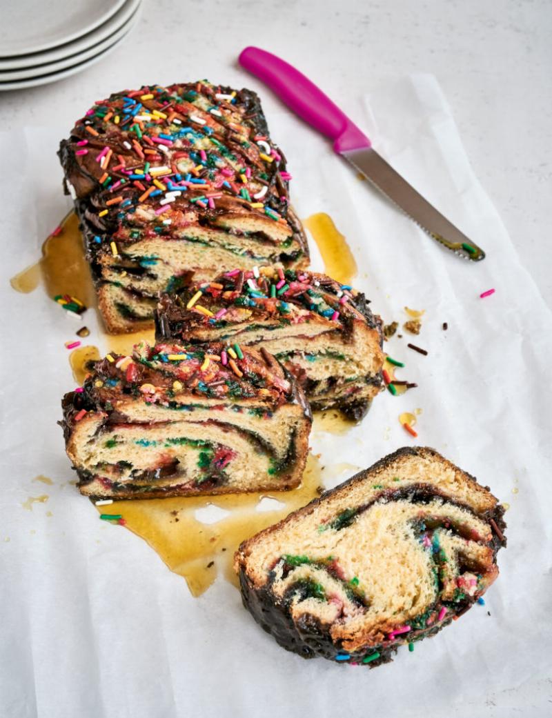 Applying Sprinkles to Buttered Bread for Fairy Bread