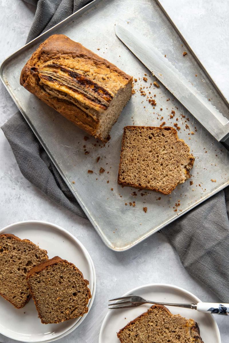 A family enjoying freshly baked banana bread together.