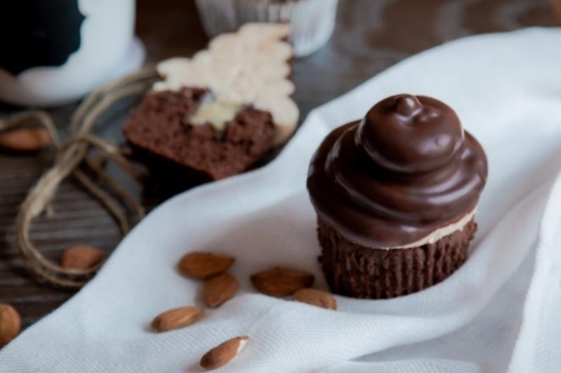 Filling cupcakes with cream using a piping bag