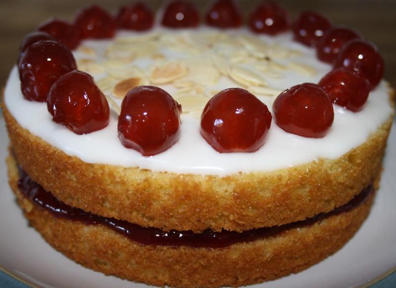 Decorated gluten-free cherry cupcakes on a cake stand