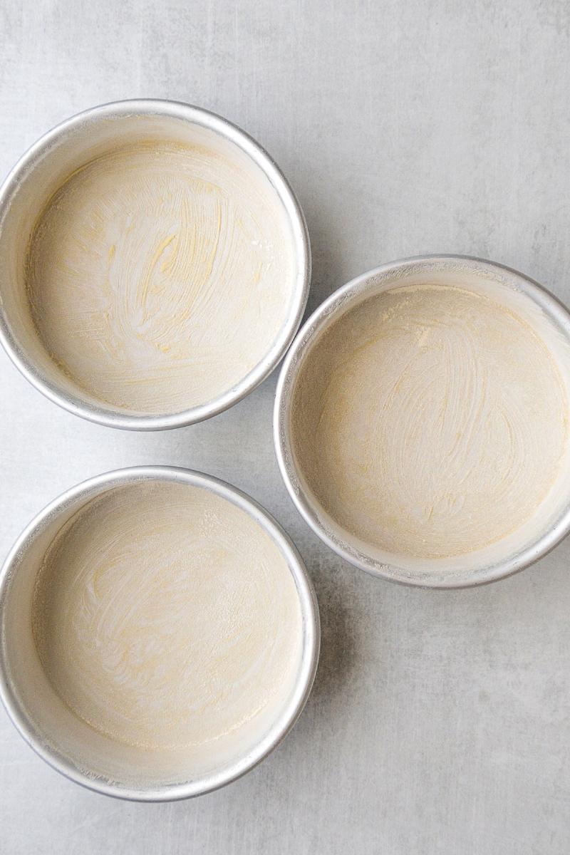 Greasing and flouring a baking pan as an alternative to lining.