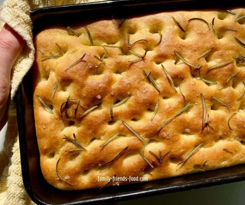 Homemade focaccia dough proofing in a warm oven