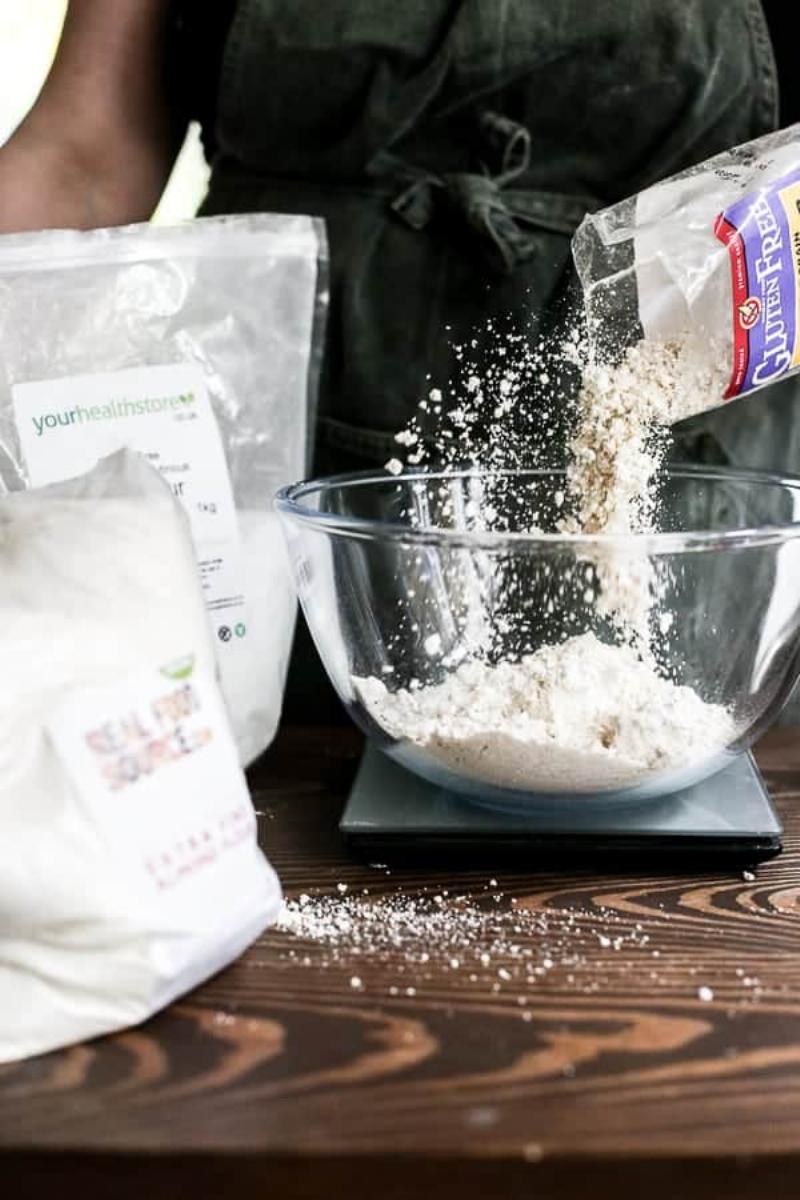 Weighing flour on a kitchen scale for precise baking measurements