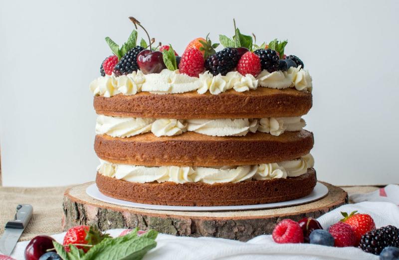 Decorating a Layered Cake with Frosting and Berries