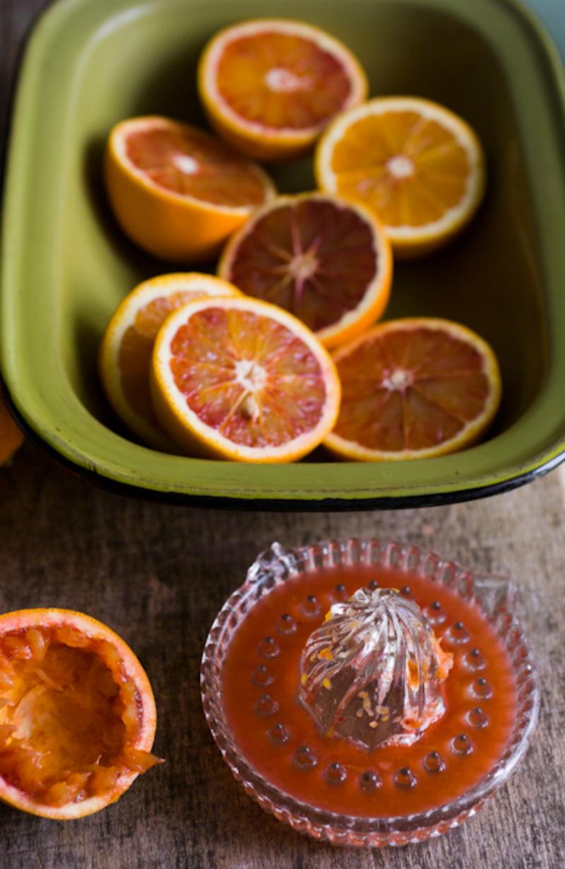 Orange Cake Baking Ingredients: A flat lay showcasing the fresh ingredients required for baking an orange cake, including fresh oranges, eggs, flour, and sugar. 