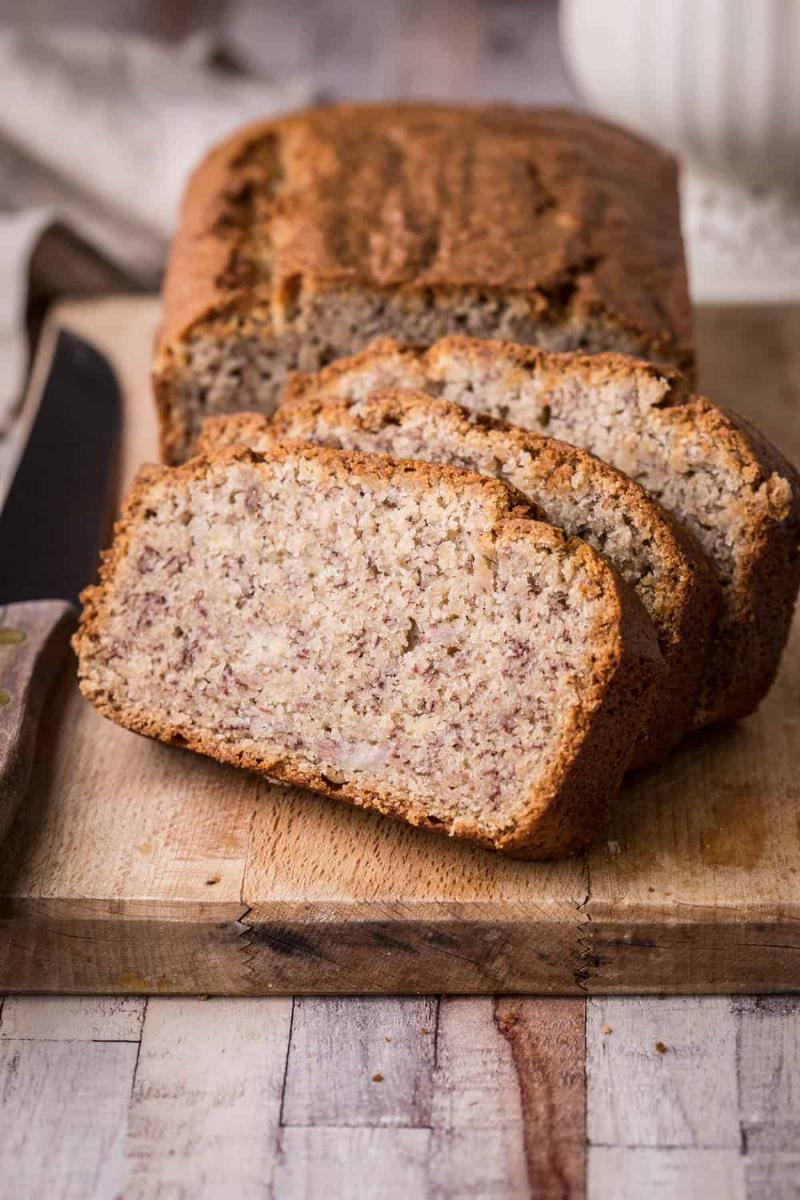 A slice of perfectly baked banana bread showcasing its moist texture.