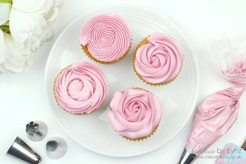 Piping buttercream rosettes onto a cupcake