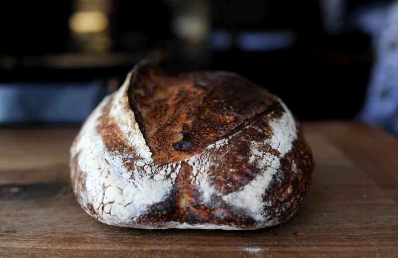 Different loaves of bread highlighting common baking problems.