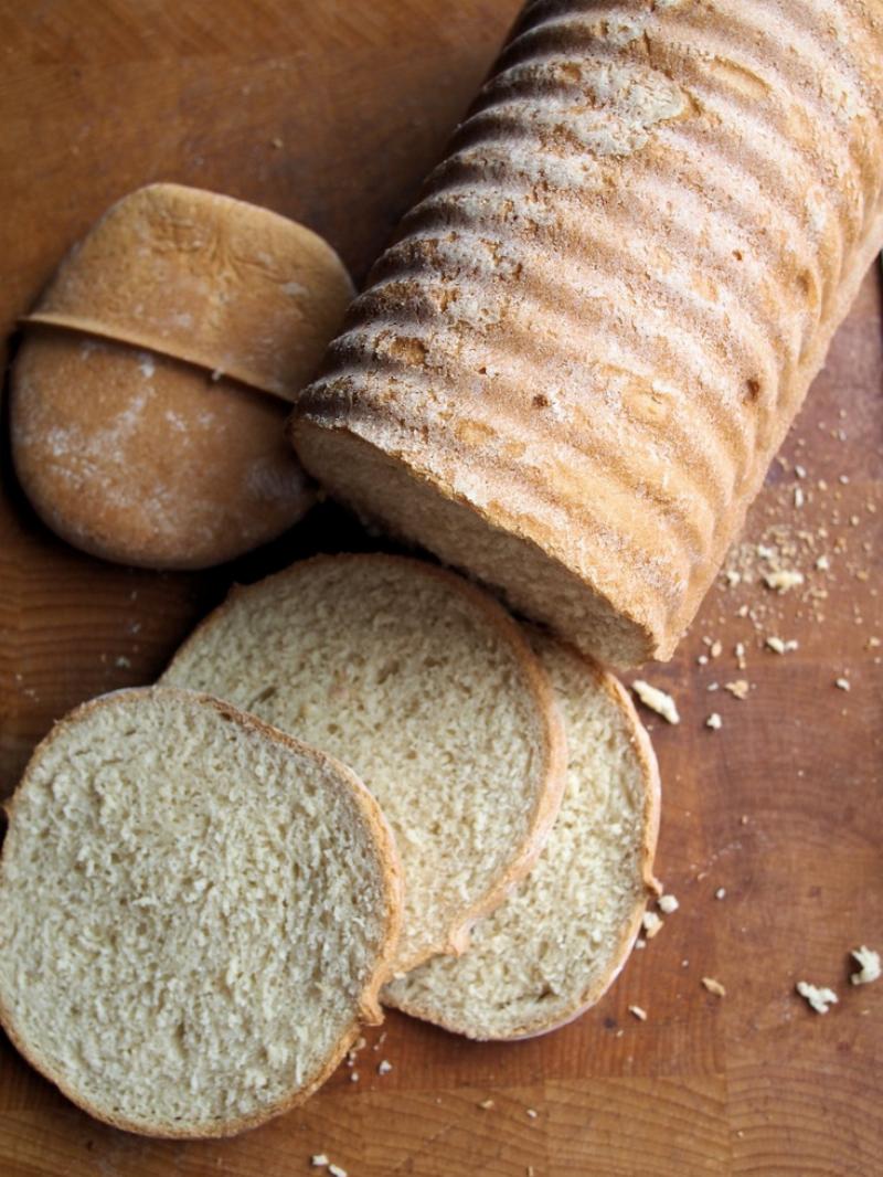 Sliced Whole Wheat Yeast Bread on a Wooden Board