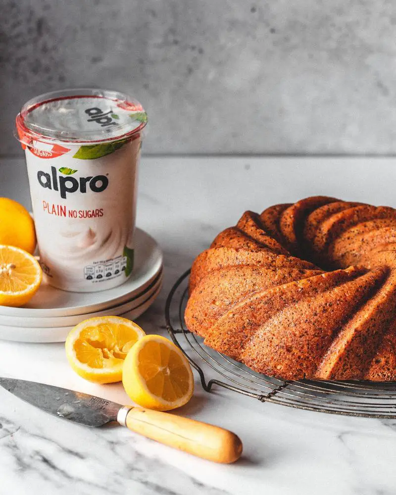 Dairy-free pound cake batter being poured into a loaf pan