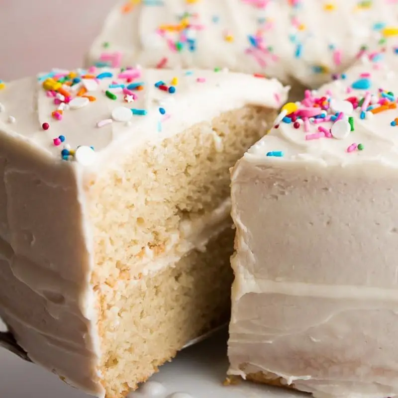 Closeup of a slice of keto spice cake with a fork, showing moist texture