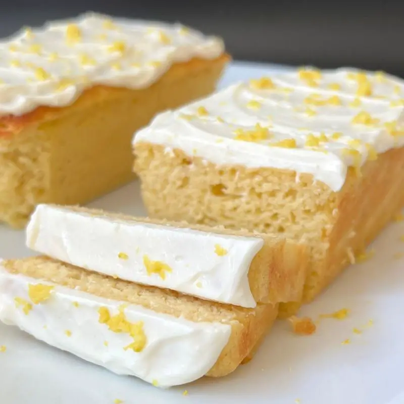 Moist slice of keto lemon avocado pound cake with a light glaze